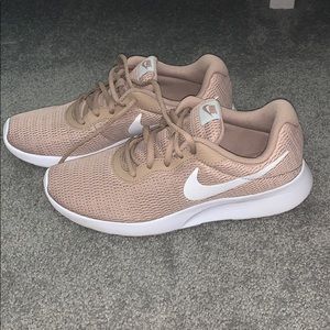 Tan Nike tennis shoes